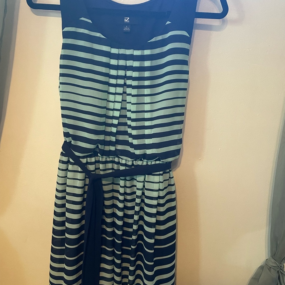 Sundress fits up to 150 pounds lies right at the knee if your 5’5. Two layers